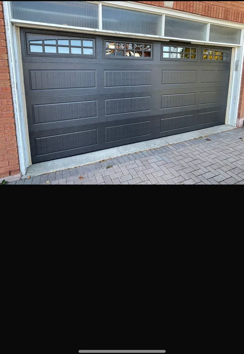 Charcoal garage door with upper glass by Garagetex