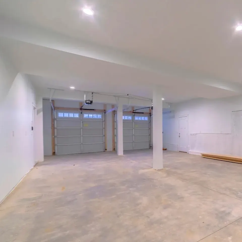 Clean garage interior with installed overhead doors by Garagetex