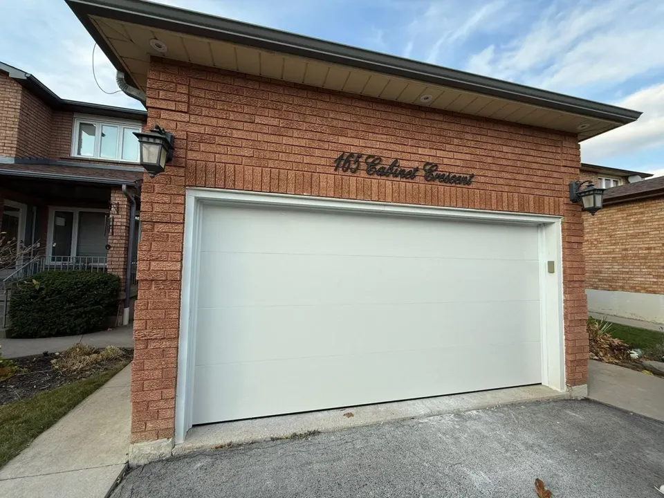 Clean white garage door replacement by Garagetex