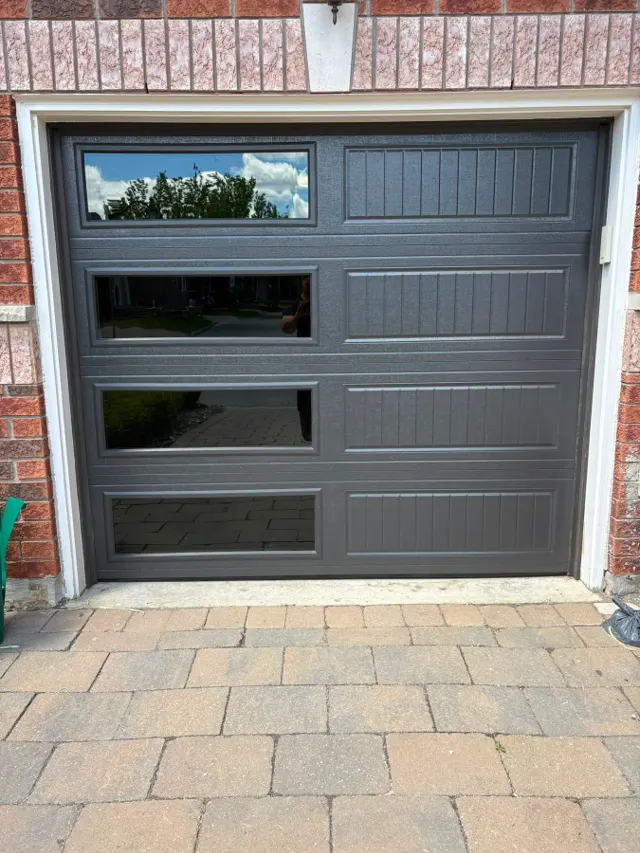 Black door with horizontal windows – Garagetex project photo